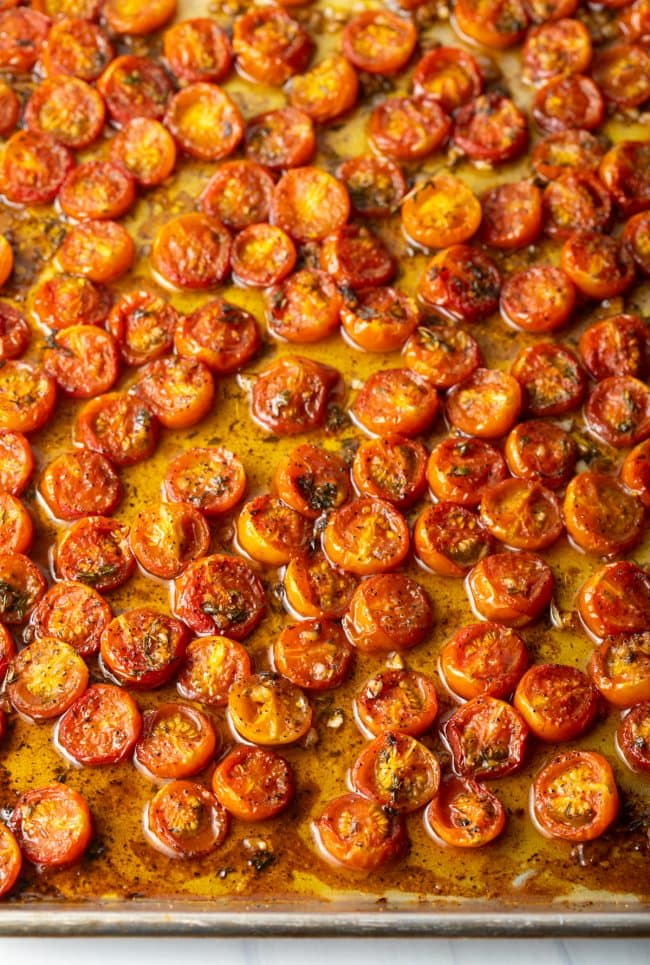 Overhead view of baking sheet with balsamic roasted tomatoes.