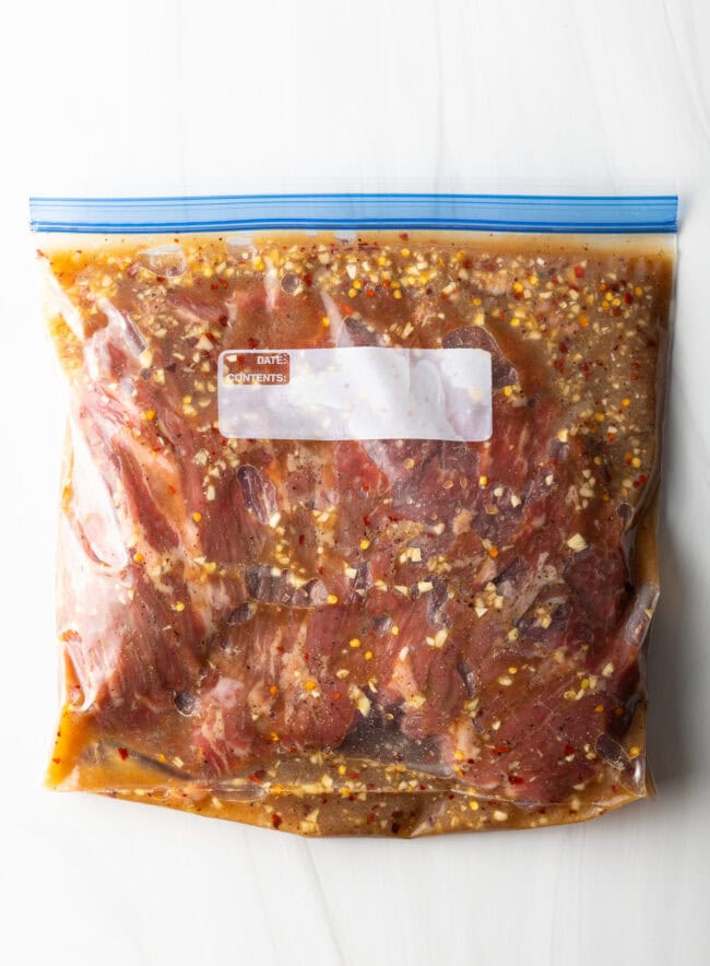 Raw meat in a ziploc bag with marinade