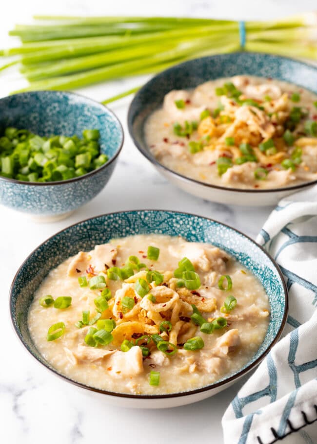 Bowls of jook with savory toppings.