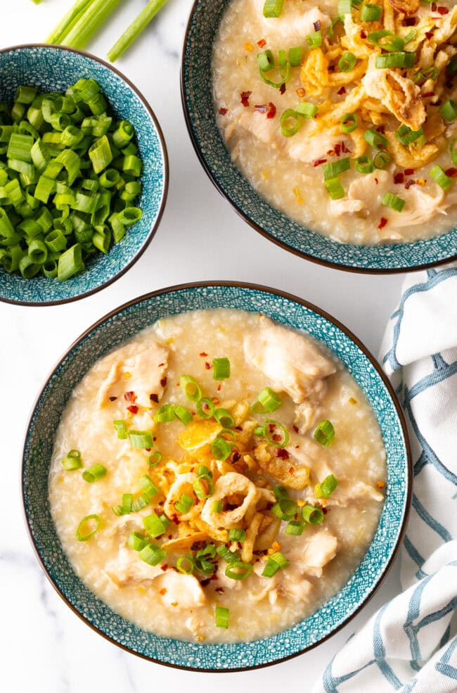 Top down view of chicken instant pot congee in a bowl with toppings.