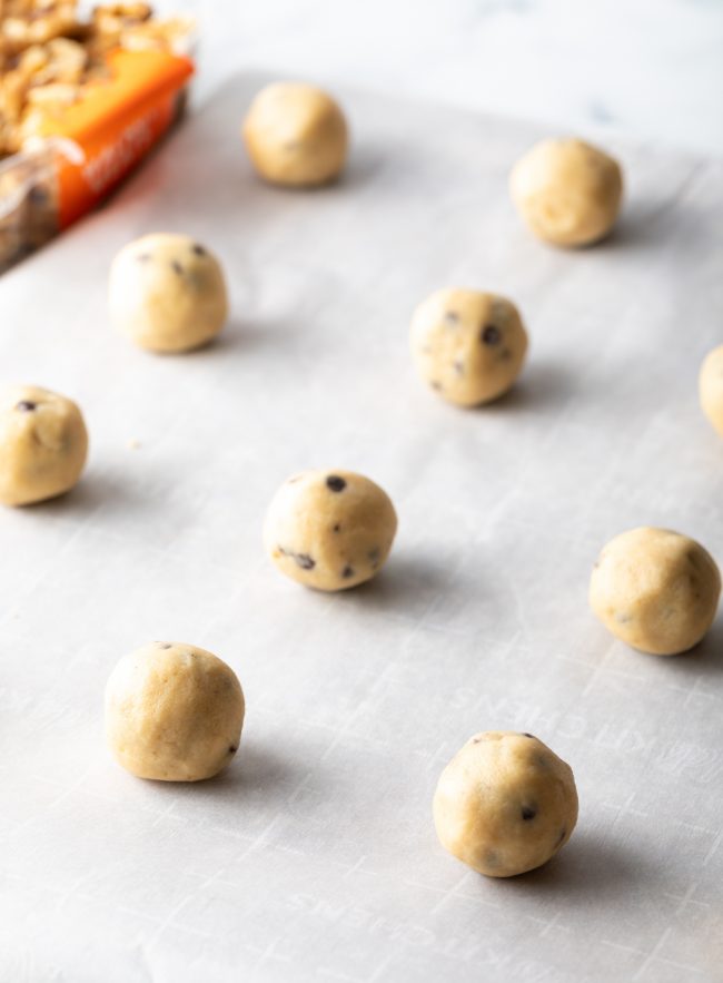 round balls of cookie dough on parchment