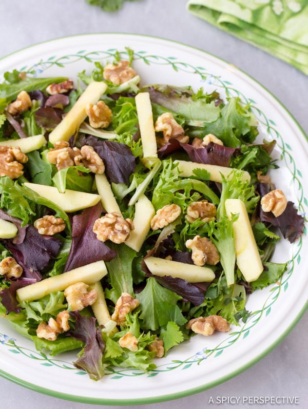 Goat Cheese Salad - greens, apples, and nuts on plate