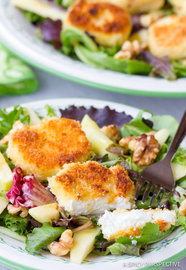 Warm Fried Goat Cheese Salad on plate with goat cheese cut open