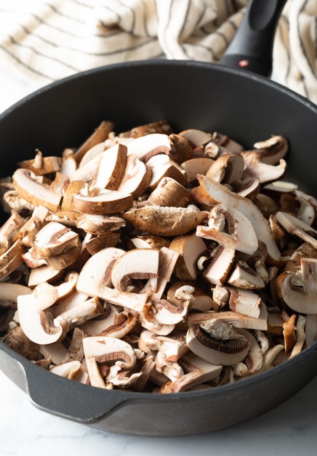 sliced mushrooms in a deep skillet