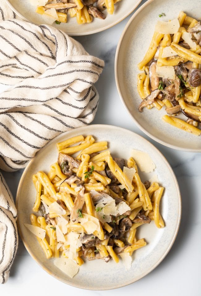 top view of two bowls of creamy mushroom sauce pasta