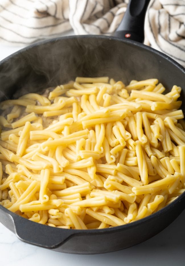 boiled and drained gemelli in a skillet