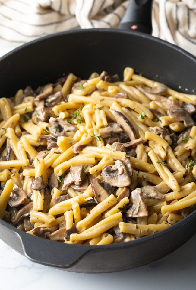 heavy skillet with gemelli mushroom pasta and cream sauce