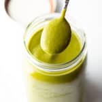 Spoonful of poblano sauce showing to camera.