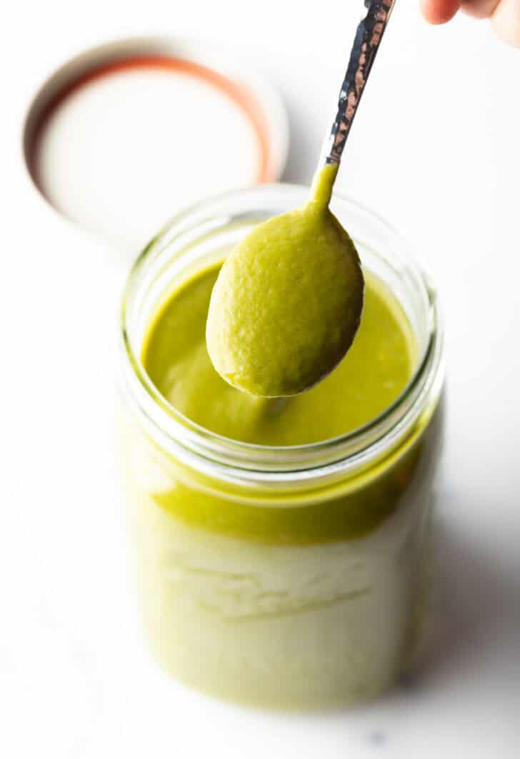 Spoonful of poblano sauce showing to camera.