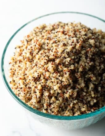 Glass bowl of fluffy quinoa.