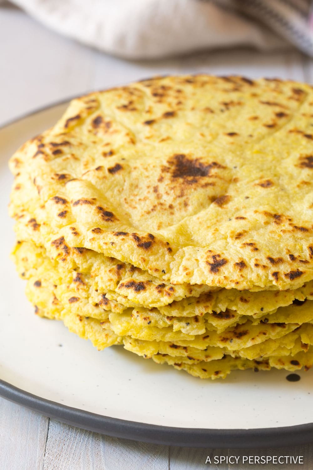 Magic Plantain Tortillas stacked on on a white plate