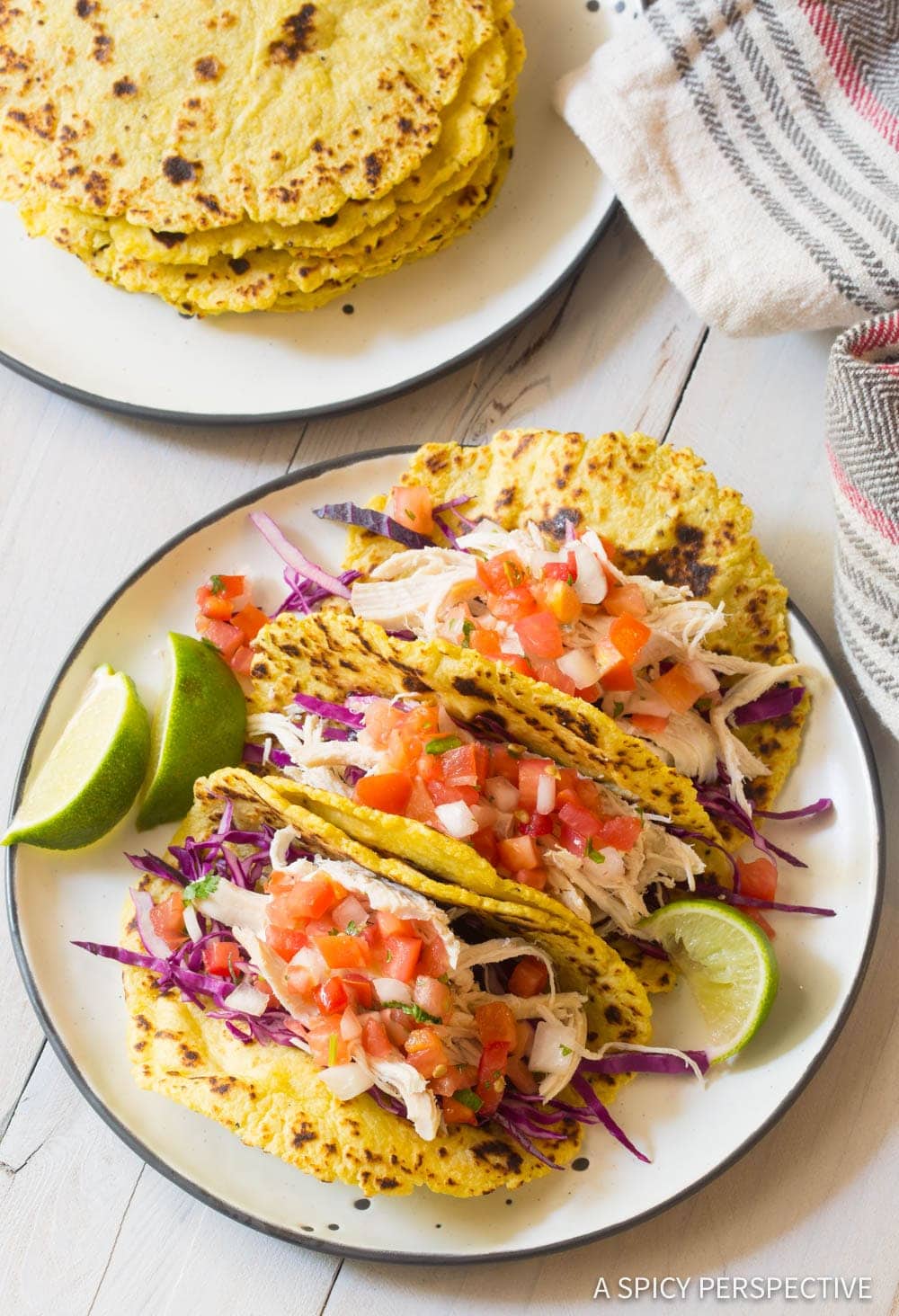 Magic Plantain Tortillas filled with taco filling on a white plate.