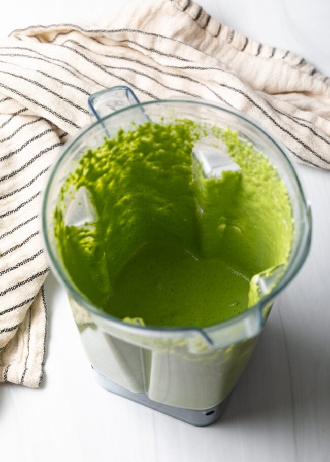 Open top blender with pureed dressing mixture.