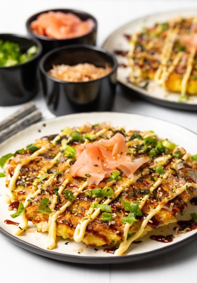 Japanese Pancakes -
okonomiyaki recipe made with shredded cabbage and sushi toppings