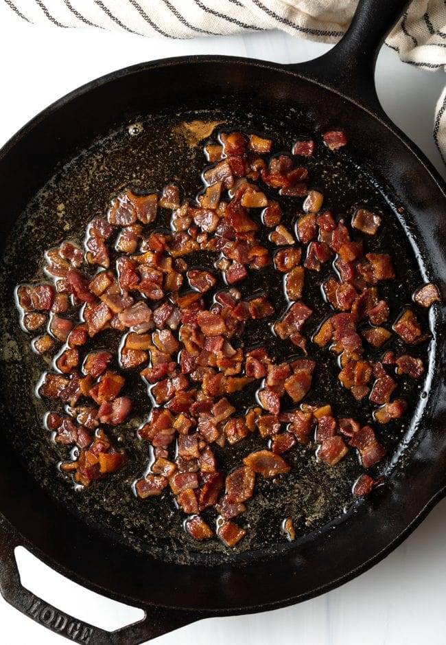 skillet with chopped cooked bacon