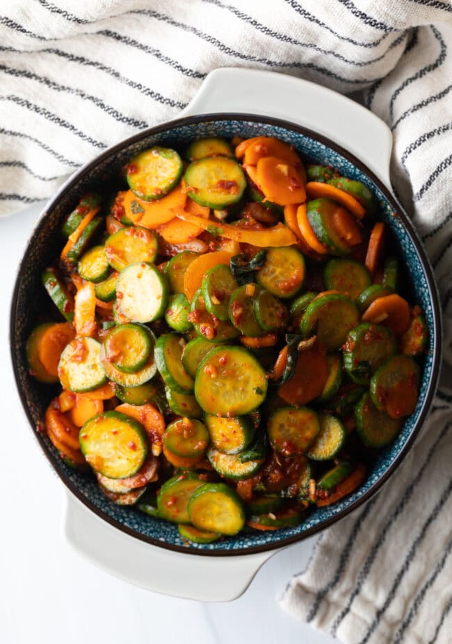 Serving of cucumber kimchi in a gray bowl.