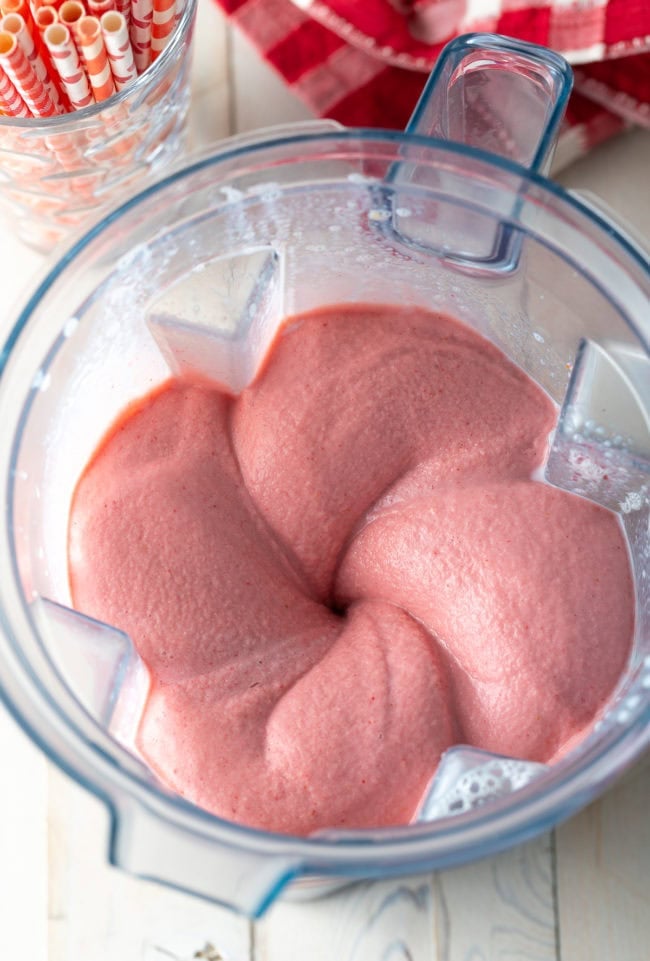 Smoothie being blended in a blender. 