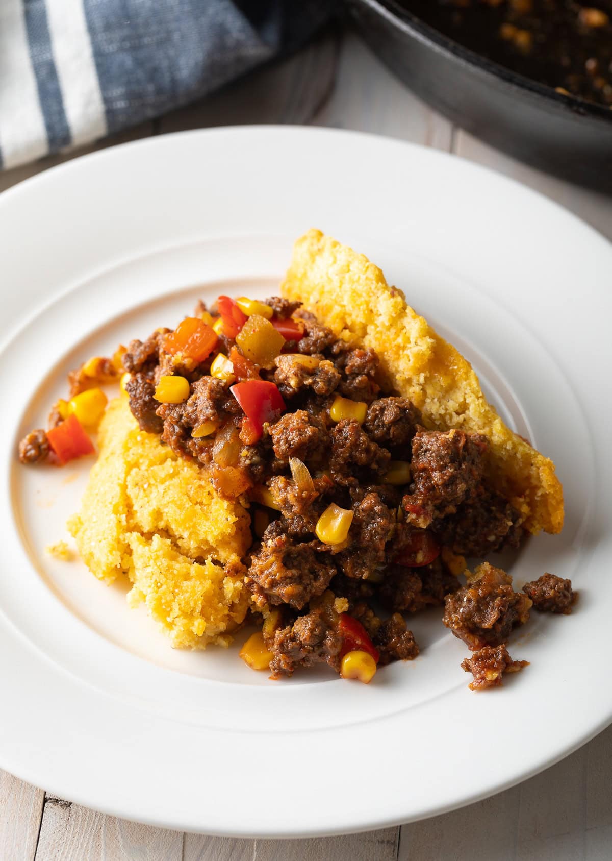 Portion of tamale pie on a white plate. 