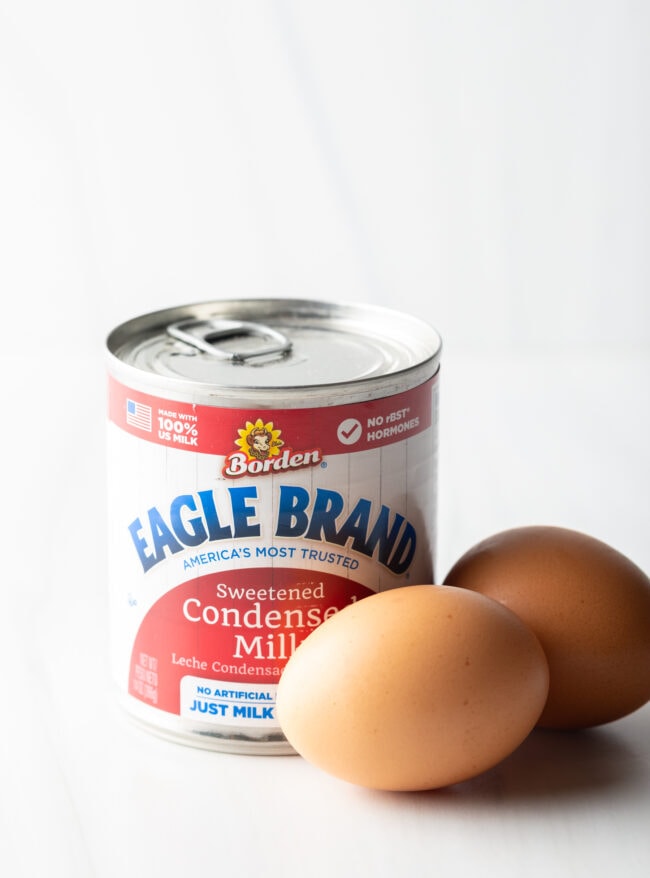 Two eggs and a can of sweetened condensed milk.